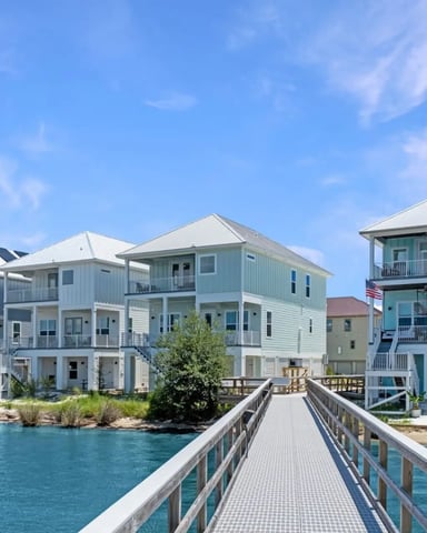 Covered waterfront deck with lounge chairs looking over the bay